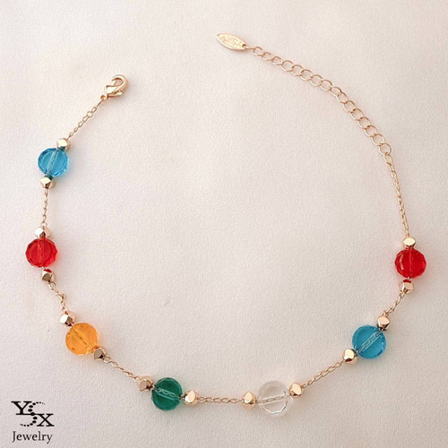 پابند طلایی برند YSX با دانههای کریستالی رنگی و زنجیر ظریف رگلاژدار