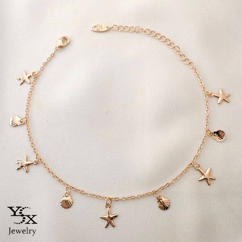 پابند طلایی برند YSX با آویزهای ستاره دریایی و صدف