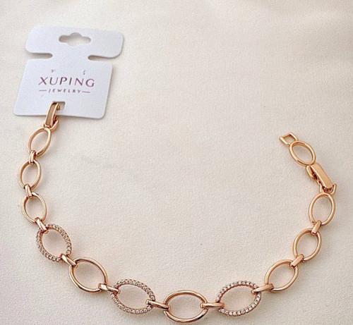 دستبند طلایی ژوپینگ با حلقههای بیضی و نگینکاری ظریف