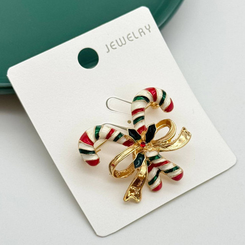 گل سینه فانتزی طرح دو عصای کریسمس با پاپیون طلایی و میناکاری رنگی