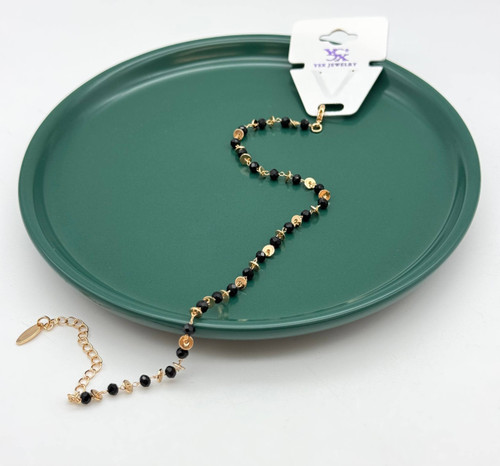 پابند ظریف برند YSX با مهرههای مشکی تراشخورده و پولکهای طلایی