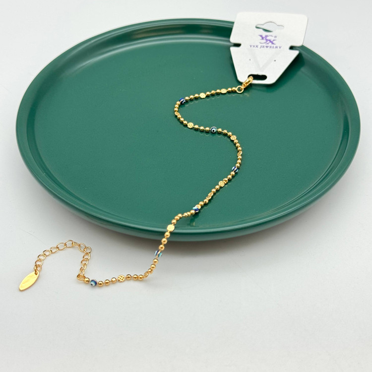 پابند ظریف طلایی برند YSX با مهرههای چشمنظر و گویهای تراشخورده