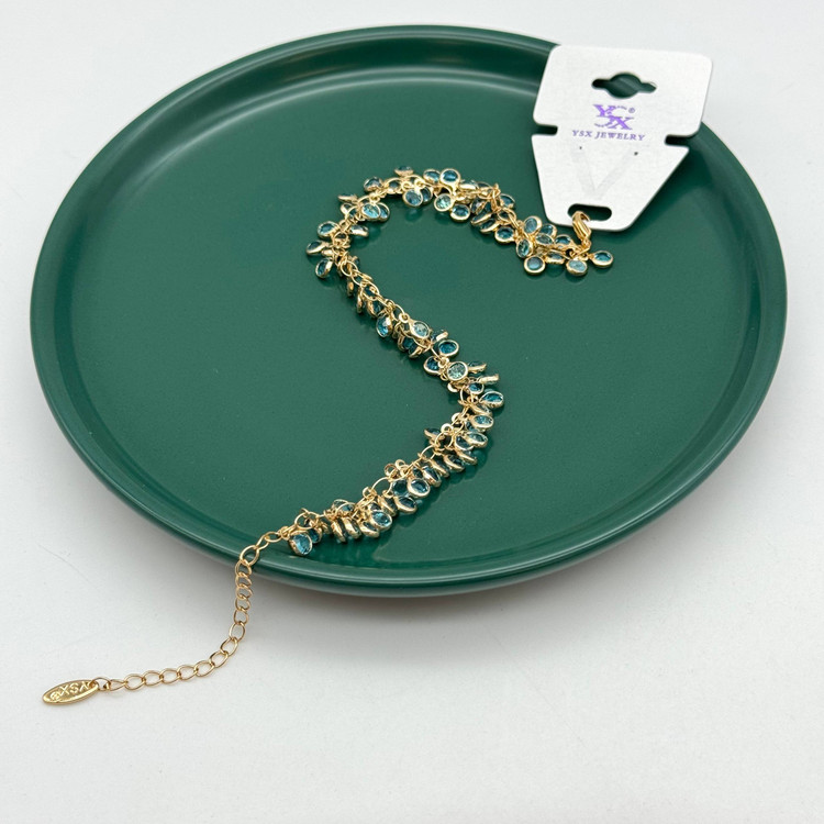 پابند طلایی برند YSX با آویزهای نگیندار آبی