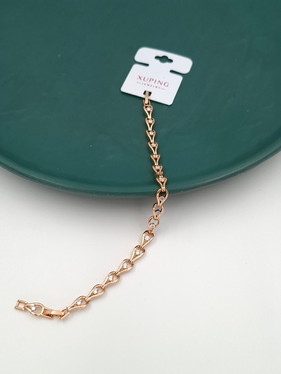 دستبند طلایی ژوپینگ با طرح اشک و نگینهای سفید