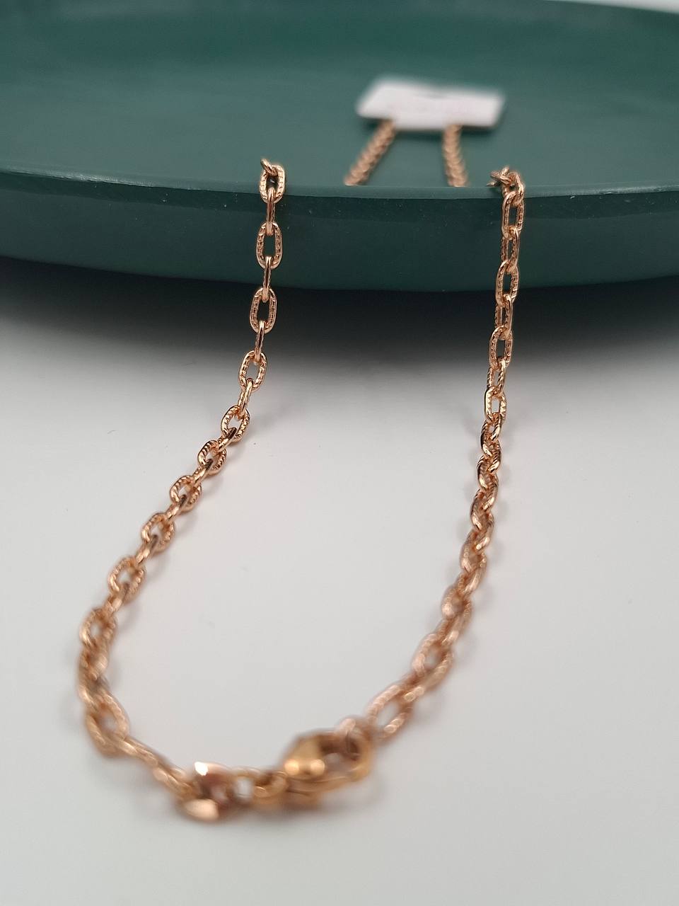 زنجیر زنانه برند ژوپینگ اصل رنگ رزگلد با بافت حلقهای ظریف