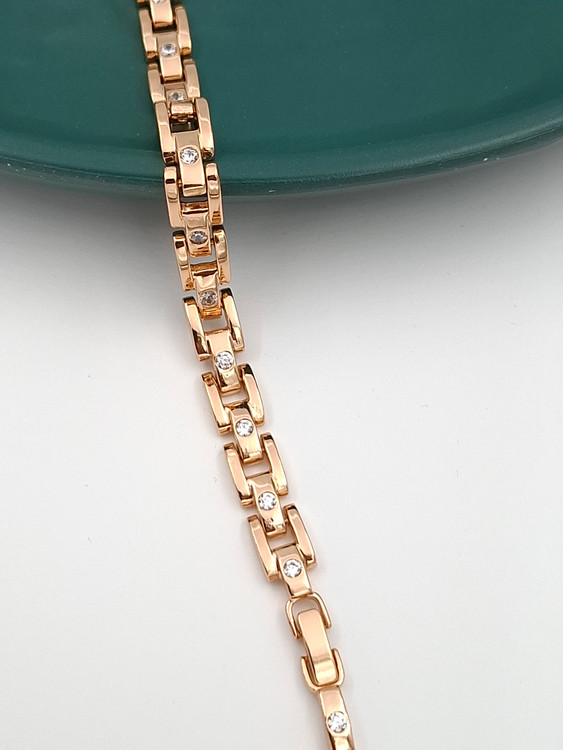 دستبند طلایی ژوپینگ طرح پیوندی با نگینهای سفید